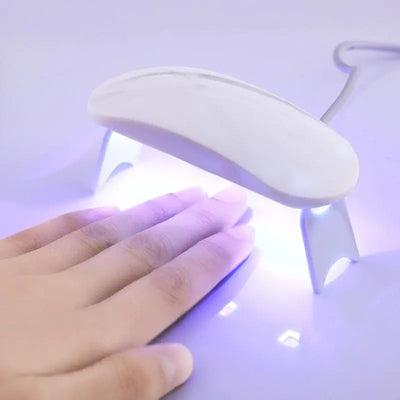 Set of nail gel stickers with UV lamp