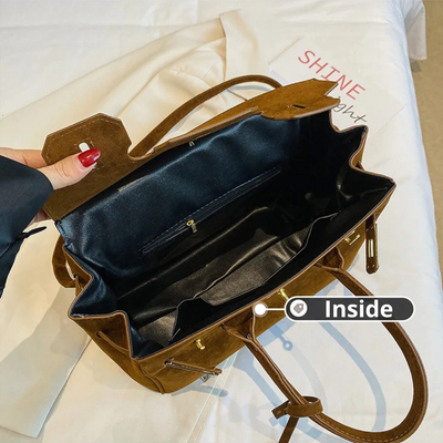 Kelly | Borsa a tracolla in camoscio con ferrature dorate