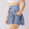 Mulher Minifalda Cintura alta com dobras e shorts integrados