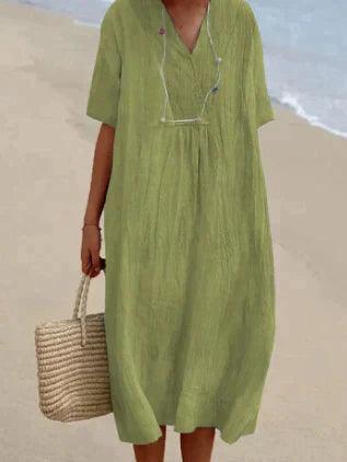 Vestido de mulher de linho com um V -Neck - mangá curto e corte relaxado