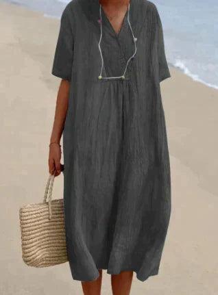 Vestido de mulher de linho com um V -Neck - mangá curto e corte relaxado