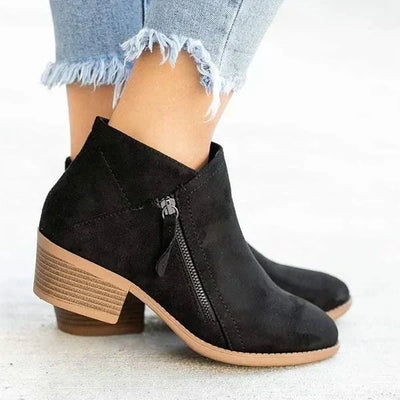 Botas com o zíper feminino